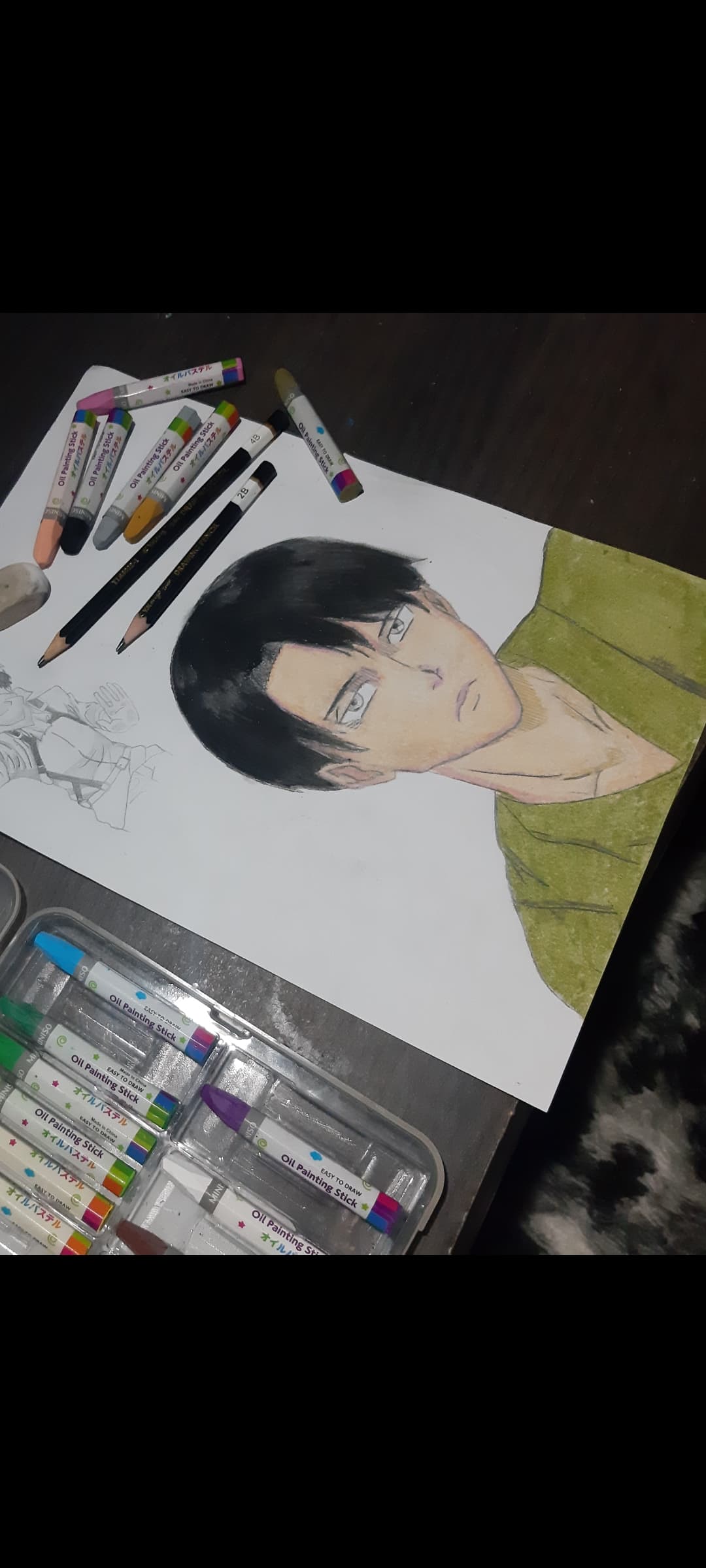 Levi using wax colour pencils